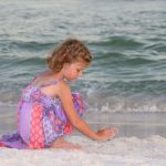 young girl playing in the sand at Henderson State Park, Destin Florida