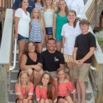 family photo on stairs in Destin Florida