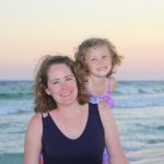 mother and daughter in front of the ocean on the beaches of Destin Florida